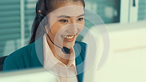 Businesswoman wearing headset working actively in office