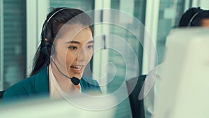 Businesswoman wearing headset working actively in office