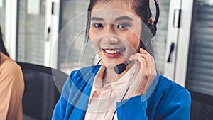 Businesswoman wearing headset working actively in office