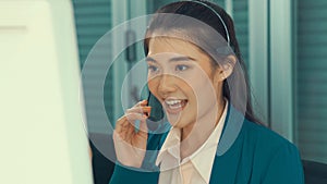 Businesswoman wearing headset working actively in office