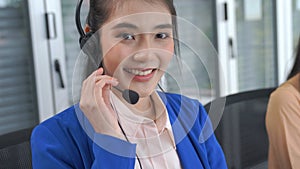 Businesswoman wearing headset working actively in office