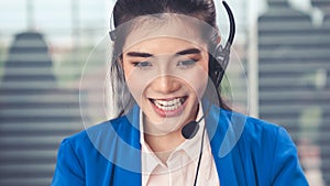 Businesswoman wearing headset working actively in office