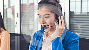 Businesswoman wearing headset working actively in office