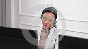 Businesswoman wearing headset working in crucial office