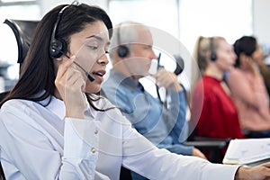 Businesswoman wearing headset working at office