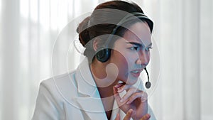 Businesswoman wearing headset working in vivancy office