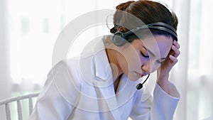 Businesswoman wearing headset working in vivancy office