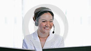 Businesswoman wearing headset working in vivancy office