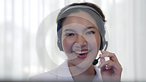 Businesswoman wearing headset working in vivancy office