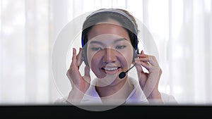 Businesswoman wearing headset working in vivancy office