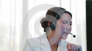 Businesswoman wearing headset working in vivancy office