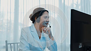 Businesswoman wearing headset working in vivancy office