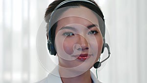 Businesswoman wearing headset working in vivancy office