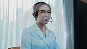 Businesswoman wearing headset working in vivancy office