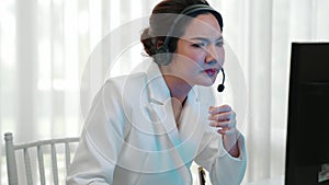 Businesswoman wearing headset working in vivancy office