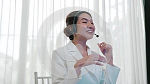 Businesswoman wearing headset working in vivancy office