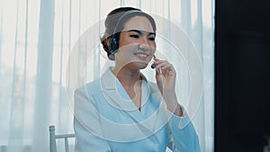 Businesswoman wearing headset working in vivancy office