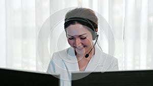 Businesswoman wearing headset working in vivancy office