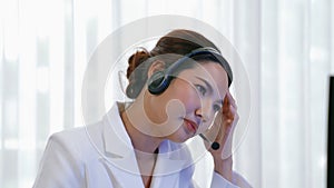 Businesswoman wearing headset working in vivancy office