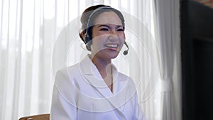 Businesswoman wearing headset working in vivancy office