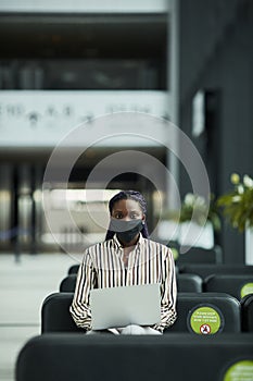 Businesswoman Wearing Mask at Work