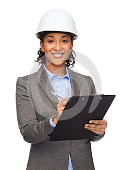 Businesswoman in white helmet with clipboard