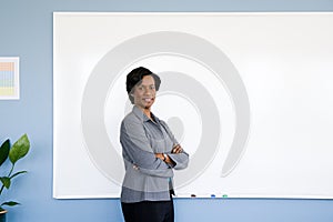 Businesswoman by whiteboard photo