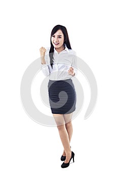 Businesswoman winning isolated on white