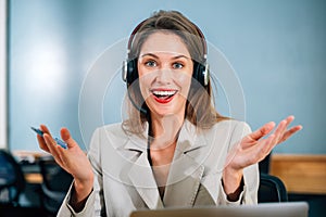 Businesswoman with wireless headphones meeting and having conversation