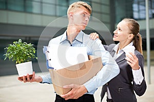 Businesswoman is wishing good luck to worker