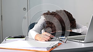 Businesswoman or Woman staff sleep in front of computer. Fatigue from work concept.