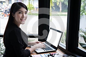 Businesswoman work with laptop at office. business person use co