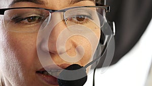 Businesswoman working in a call center. customer service proffessional talking on headset. 4K