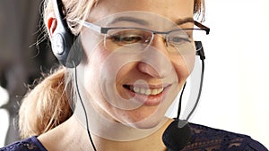 Businesswoman working in a call center. customer service proffessional talking on headset. 4K