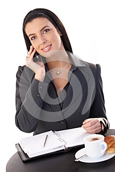 Businesswoman working at coffee break