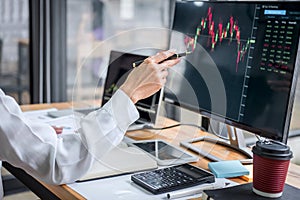 Businesswoman working with computer, laptop, thinking and analyzing graph stock market trading with stock chart data planning,