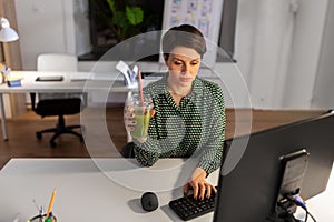 Businesswoman working on computer at night office