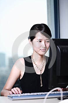 Businesswoman working with computer in office