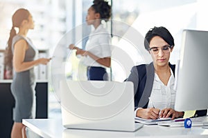 Businesswoman, working and computer in office, writing notes and laptop. Workplace, corporate and signing document at