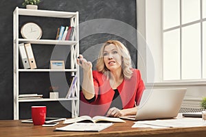 Businesswoman working with documents at office desktop