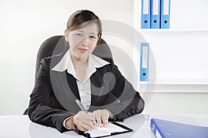 Businesswoman working on her desk