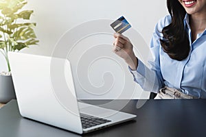 Businesswoman working from home online shopping, e-commerce, internet banking, spending money.