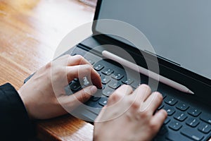 Businesswoman working with keyboard of tablet portable at office. Business technology concept