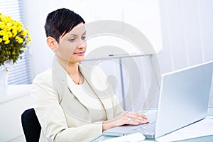 Businesswoman working on laptop