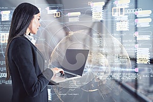 Businesswoman working with laptop on coding sketch concept background with world map.