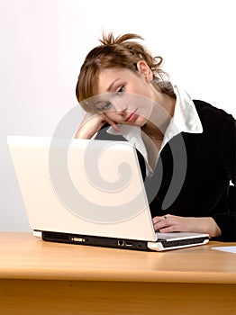 Businesswoman working on laptop at a desk