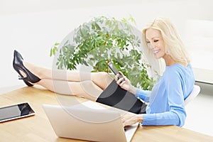 Businesswoman working on laptop at the office