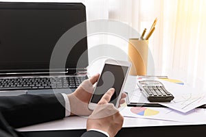 Businesswoman working with modern devices, labtop computer and m