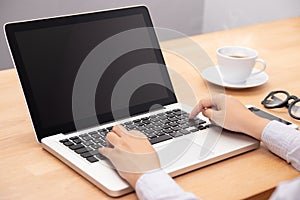 Businesswoman working with notebook laptop computer, using finger with keyboard for typing. computer laptop with black screen