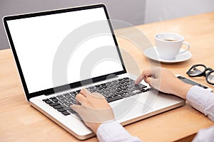 Businesswoman working with notebook laptop computer, using finger with keyboard for typing. computer laptop with blank screen